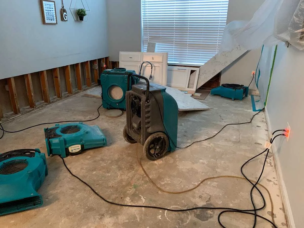 Dehumidifier in flood-cut room for Water Damage Restoration in The Colony